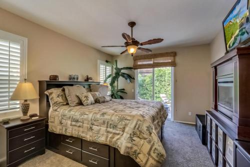 a bedroom with a bed and a ceiling fan at Indian Palms Vacation Villa Permit# 50273 in Indio