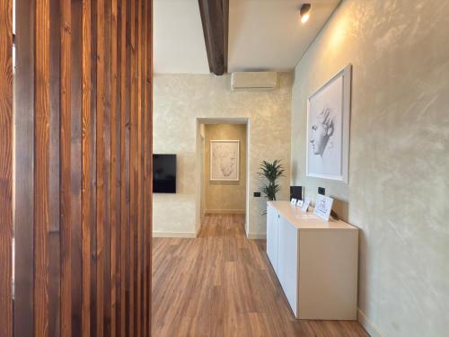 an office with a hallway with a desk and a television at Pantheon Urbes Collection in Rome
