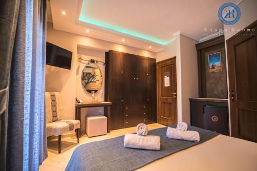 Postel nebo postele na pokoji v ubytování Kappa Rooms Boutique Hotel