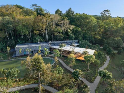 an aerial view of a house in the woods at Sendoro Retreat in Láng Lớn