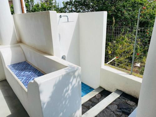 an open door to a balcony with a window at Casa Mandarino - central, see view and silence in Stromboli