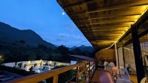 a balcony of a hotel with a view of the mountains at Las Terrazas de Dana Boutique Lodge & Spa in Mindo