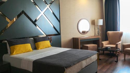 Postel nebo postele na pokoji v ubytování Sultasa Hotel