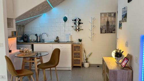 a kitchen with a table and chairs in a room at The Dream in Massa Lubrense