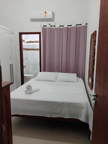 Postel nebo postele na pokoji v ubytování Hospedagem Casa estrada real Paraty