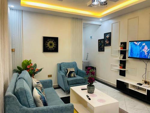 TV a/nebo společenská místnost v ubytování Lavender Homes