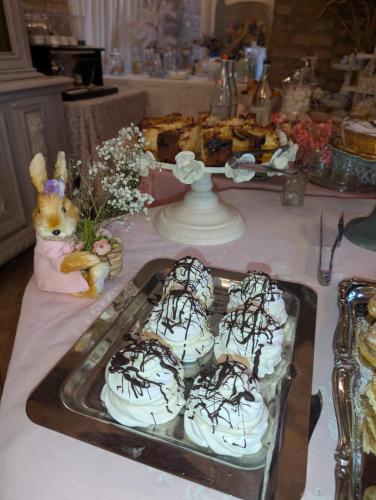a table with a tray of desserts on it at Agriturismo le Fontanelle da Valente in Montichiari
