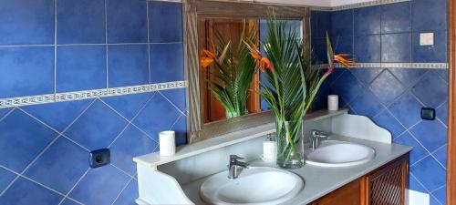 a blue bathroom with two sinks and a mirror at VILLA NABRISA MARBELLA, 5 BEDROOM, PRIVATE POOL, GARDEN, BBQ in Marbella