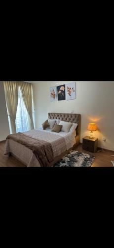Una cama o camas en una habitación de jambo apartment 3