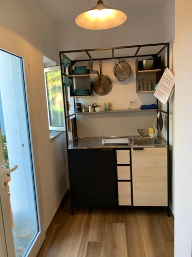 a kitchen with a sink and a counter at Terra in Valledoria