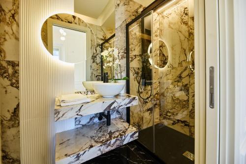 a bathroom with a sink and a mirror at Residenza Alferini - San Pietro in Rome