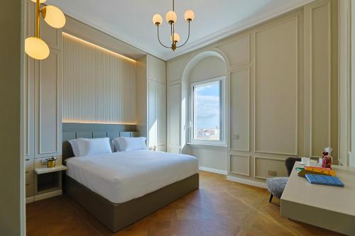a hotel room with a bed and a window at Residenza Alferini - San Pietro in Rome