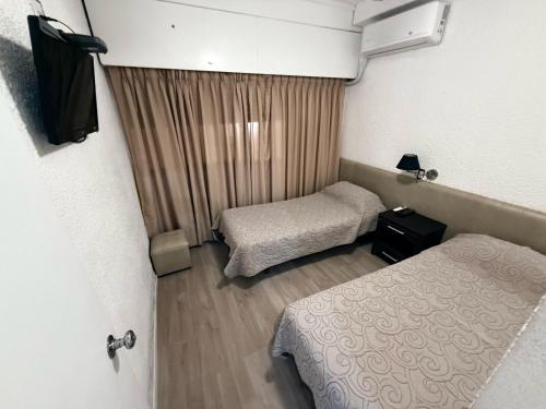 Una cama o camas en una habitación de Punta del Este Shelton Hotel
