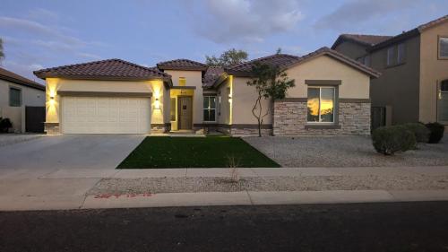 a large house with a driveway in front of it at Spacious 5 BD Luxury Getaway Near Westgate in Glendale