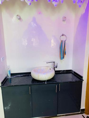 a bathroom with a counter with a sink on it at Al confort in Fez