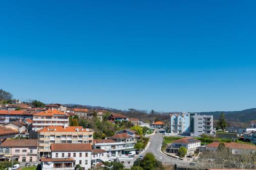 a view of a city with houses and a road at Casinha da Avó Ana in Sever do Vouga