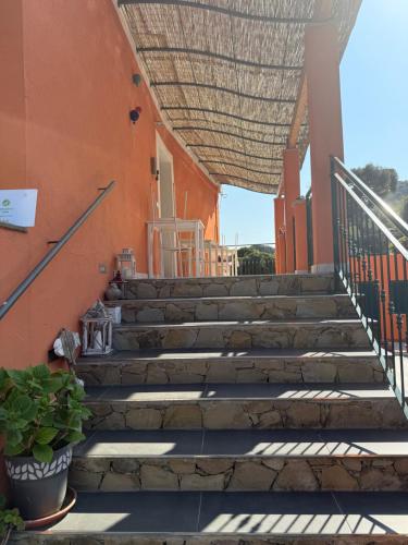 a set of stairs leading up to a building at Agriturismo Un Mare di Fiori in Ventimiglia