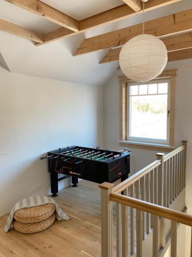 a room with a pool table in the corner of a room at Dom nad Buwełnem in Marcinowa Wola
