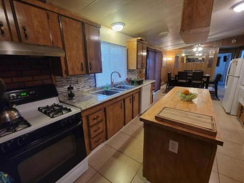 a kitchen with a stove and a counter top at Campground at Sequoia Mountain Farms - Bring Your Own Tent or RV - No Bedrooms or Beds Provided in Miramonte