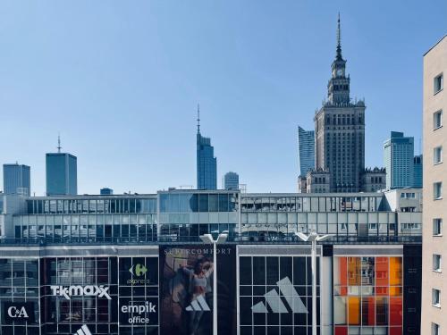 a view of a city skyline with tall buildings at ComeWa Apartments in Warsaw