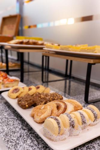 a plate of pastries and cookies on a table at Hotel España in Mar del Plata