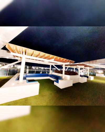 a rendering of a bus station with a blue bench at Cozy 1BR with City View, Beach Access and Wave Pool in Manila