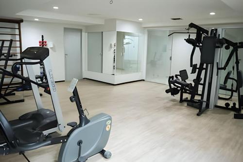 a gym with treadmills and elliptical machines at Paraíso beira-mar em Tambaú! Nobile Suites #508 in João Pessoa