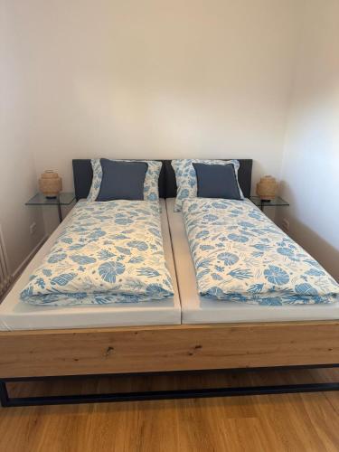 a bed with two pillows on top of it at gemütliche Ferienwohnung Anker in Schilksee am Strand in Kiel