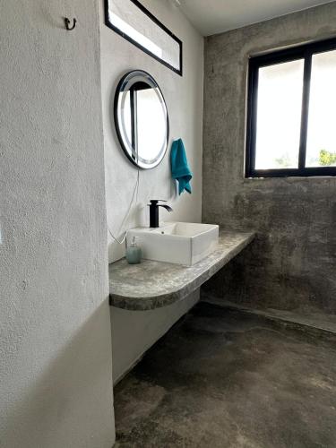 a bathroom with a sink and a mirror at Very quiet in Isla Mujeres