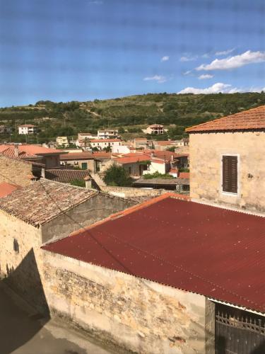 a view of a city with a red roof at House in Rural Sardinia in Collinas