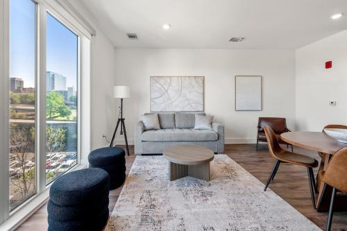 a living room with a couch and a table at The Nomad ATL in Atlanta