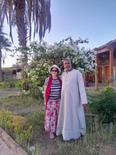 a man and a woman posing for a picture at Osiris Guest House in Abu Simbel