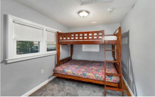 a small bedroom with a bunk bed and a window at NEW Calm Cove Retreat w Dock & Beach in Alton