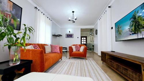 Χώρος καθιστικού στο Tranquility Homes Muyenga