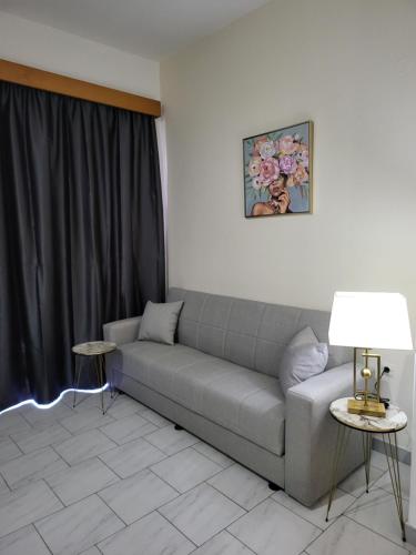 a living room with a couch and a table at Pyrgos Hotel Apartments in Kremasti