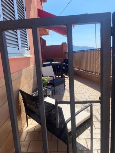 a balcony with two chairs and a table on a patio at Casa Vacanze Fabrizio in Balestrate