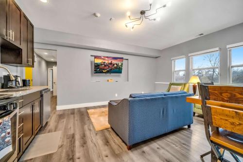 a kitchen with a couch in the middle of a room at Cle Suites 2BR 1BA 5 min Walk to Cle Clinic Unit 4 in Cleveland