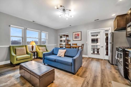 a living room with a blue couch and chairs at Cle Suites 2BR 1BA 5 min Walk to Cle Clinic Unit 4 in Cleveland