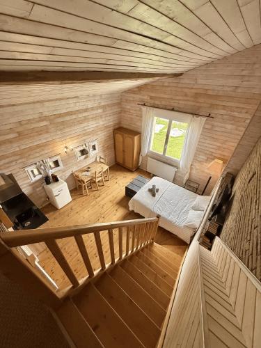 an overhead view of a room with a bed and a staircase at Le Loft de l'Artisterie in Mondonville