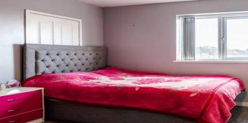 a bedroom with a red bed and a window at CasaVacanze NewlyRenovated Luxury in Illes Balears