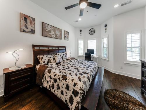 a bedroom with a bed and a dresser and a tv at A Homely Getaway in Lewisville