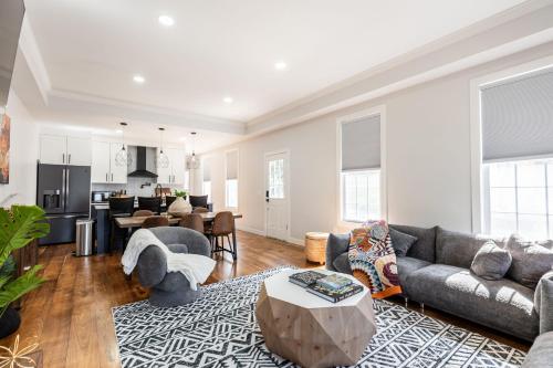 a living room with a couch and a table at Spacious & Cozy Central Cincinnati Home in Cincinnati