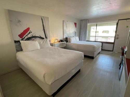 Katil atau katil-katil dalam bilik di Cozy hotel with Super location near Disney