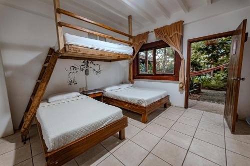 Postel nebo postele na pokoji v ubytování Hotel Nantu Hostería