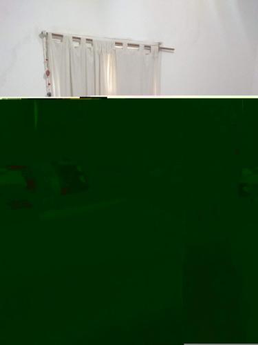 a green picture of a shower with a curtain at Hosteria Calamuchita in Villa del Dique