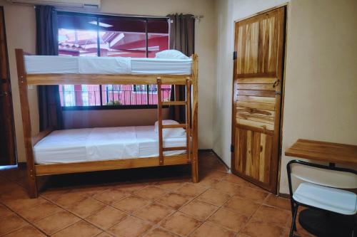 Una cama o camas en una habitación de Hospedaje Papalotes
