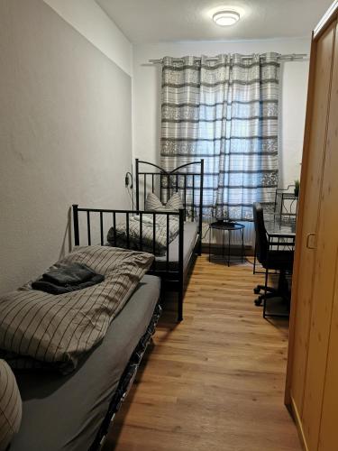 a bedroom with two bunk beds and a window at SaxonyBNB in Waldheim