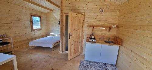 Postel nebo postele na pokoji v ubytování Bobry Zagajnik
