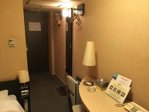 Ένα ή περισσότερα κρεβάτια σε δωμάτιο στο Hotel Crown Hills Kushiro