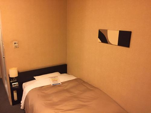 Ένα ή περισσότερα κρεβάτια σε δωμάτιο στο Hotel Crown Hills Kushiro